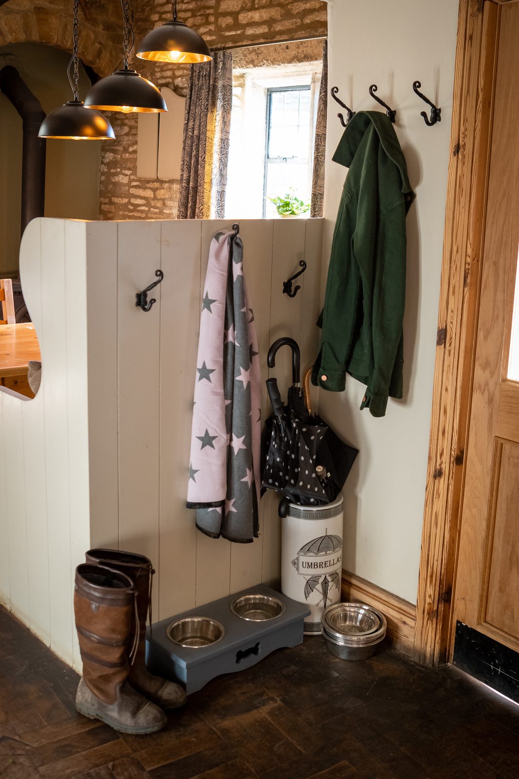 Walking boots and coats by the door